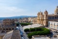 View of the baroque cathedral, town hall and the main street of