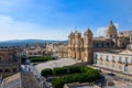 View of the baroque cathedral, town hall and the main street of