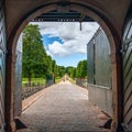 View of the Baroque style formal garden through the open gate.Frederiksborg Castle.Denmark Royalty Free Stock Photo