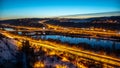View of Barrandov Bridge over Vltava River in Branik, Prague, Czech Republic. Illuminated roads in cold winter evening Royalty Free Stock Photo
