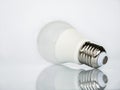 View from the base of the socket on an LED lamp isolated on a white background with reflection Royalty Free Stock Photo