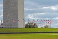 American flags surround the base of Washington monument in Washington DC, USA. Royalty Free Stock Photo