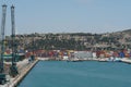 View on basin with green cargo cranes used for scrap situated in the port.