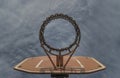View of Basketball backboard with the hoop metal ring and steel chain net against blue sky background seen from below Royalty Free Stock Photo
