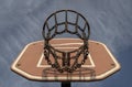 View of Basketball backboard with the hoop metal ring and steel chain net against blue sky background seen from below Royalty Free Stock Photo