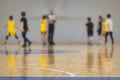 View of basketball court hall indoor venue with junior teenage school team playing in the background, basketball match game on Royalty Free Stock Photo