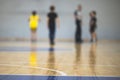 View of basketball court hall indoor venue with junior teenage school team playing in the background, basketball match game on Royalty Free Stock Photo
