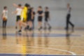 View of basketball court hall indoor venue with junior teenage school team playing in the background, basketball match game on Royalty Free Stock Photo