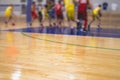 View of basketball court hall indoor venue with junior teenage school team playing in the background, basketball match game on Royalty Free Stock Photo