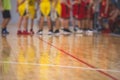 View of basketball court hall indoor venue with junior teenage school team playing in the background, basketball match game on Royalty Free Stock Photo