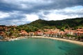 A view of the bay and beach of Collioure with Saint Elme Fort on the hill Royalty Free Stock Photo