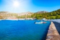 View of bay with boats and Monastery of Taxiarchis Mihail Panormitis on Island of Symi  Rhodes, Greece Royalty Free Stock Photo