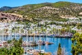 View of the bay of Bodrum. Beautiful colorful yachts in the background of the town and mountains.