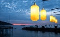 View of Bay of Naples from Sorrento, Italy. Lights on the pier in the foreground. Two mast sailing boat in silhouette in distance. Royalty Free Stock Photo