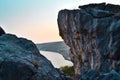 view of the bay of the sea through between stone rocks, cliffs, evening sun