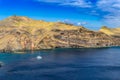 View of the bay and yacht at between cliffs at Ponta de Sao Lourenco, Madeira Royalty Free Stock Photo