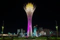 View the Bayterek monument and observation tower at night in Astana, Kazakhstan.