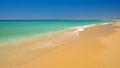 View on the beach Alvor Poente with beautiful water color and golden sand. Algarve, Portugal Royalty Free Stock Photo
