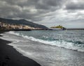 View from the beach Bahamar. Bad weather on La Palma. Ferries between the islands. Black sand of the Canary Islands.