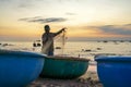 View of the beach at the basket boat dock at sunset Royalty Free Stock Photo