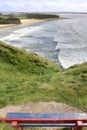 View of beach and cliffs in Ballybunion from bench Royalty Free Stock Photo