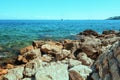 View of the beach Du Ponteil of the town Antibes.with the Cap d `Antibes peninsula in the background Royalty Free Stock Photo