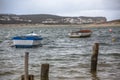 View of beach in lagoon on Nazare with traditional fishing boats, in Portugal