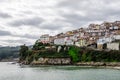 View from the beach of Lastres a village in the Cantabrian coast in Asturias Spain. White houses in a steep surface