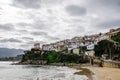 View from the beach of Lastres a village in the Cantabrian coast in Asturias Spain. White houses in a steep surface