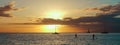 Panoramic landscape view of ocean in maui hawaii of sunset, boats and paddle boarders Royalty Free Stock Photo