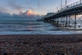 A view from the beach out down the side of the pier at Worthing, Sussex just before sunset Royalty Free Stock Photo