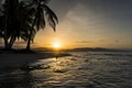 View of a beach with palm trees at sunset in Puerto Viejo de Talamanca, Costa Rica Royalty Free Stock Photo