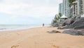 View of the beach and people walking on the sand