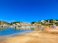View of the beach of Port de Soller with people lying on sand, Soller, Balearic islands, Spain. Royalty Free Stock Photo