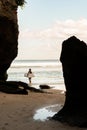 A man walking on the beach with a surfboard. Royalty Free Stock Photo