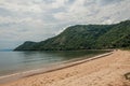 View of beach, sea and forest on cloudy day in Paraty Mirim.