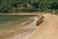 View of beach, sea, forest and people in Paraty Mirim.