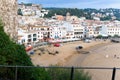 Tossa de Mar, Spain, August 2018. View of the beach and the seaside strip from the walls of the fortress.