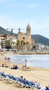 View of the beach of Sitges with church in the background Royalty Free Stock Photo