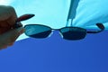 View on beach sun shield and blue skies through dioptric sunglasses with UV400 filter Royalty Free Stock Photo