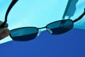 View on beach sun shield and blue skies through dioptric sunglasses with UV400 filter Royalty Free Stock Photo