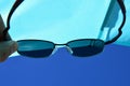 View on beach sun shield and blue skies through dioptric sunglasses with UV400 filter Royalty Free Stock Photo