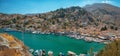 View of beautiful bay with colorful houses on the hillside of the island of Symi.