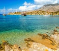 View of beautiful bay in panormitis Symi island , ships. and boats at anchor, Greece Royalty Free Stock Photo