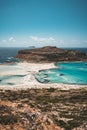 View of the beautiful beach in Balos Lagoon, and Gramvousa island on Crete, Greece. Sunny day, blue Sky with clouds. Royalty Free Stock Photo