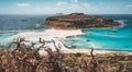 View of the beautiful beach in Balos Lagoon, and Gramvousa island on Crete, Greece. Sunny day, blue Sky with clouds.