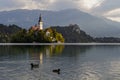 Beautiful mountain lake Bled . Pilgrimage Church of the Assumption of Maria situated on an island . Mountains in background. Slove