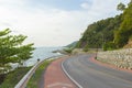 Beautiful curve road by the sea and mountain at Noen-nangphaya view point in Chanthaburi, Thailand. Royalty Free Stock Photo