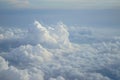 View of beautiful free form heaven white cloud with shades of blue sky background from flying plane window Royalty Free Stock Photo