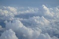 View of beautiful free form white cloud as per imagination with shades of blue sky background from flying plane window Royalty Free Stock Photo